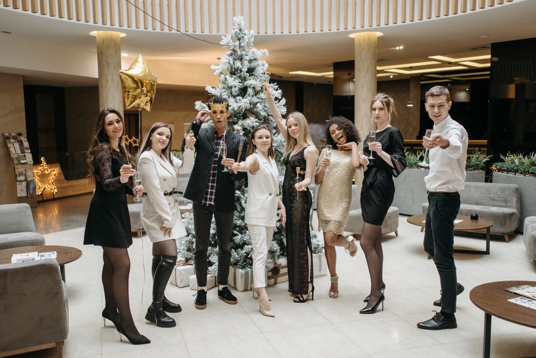 An evening party with guests raising a toast